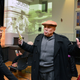 Ronald Saunders, a retired civil rights activist, speaks with Kim Lester of Clairton, Pa., before the start of the New Horizon Theater’s presentation of “Josh: The Black Babe Ruth.” Saunders volunteers with the theater, greeting patrons and handing out programs. (Nate Guidry/Pittsburgh Post-Gazette)
